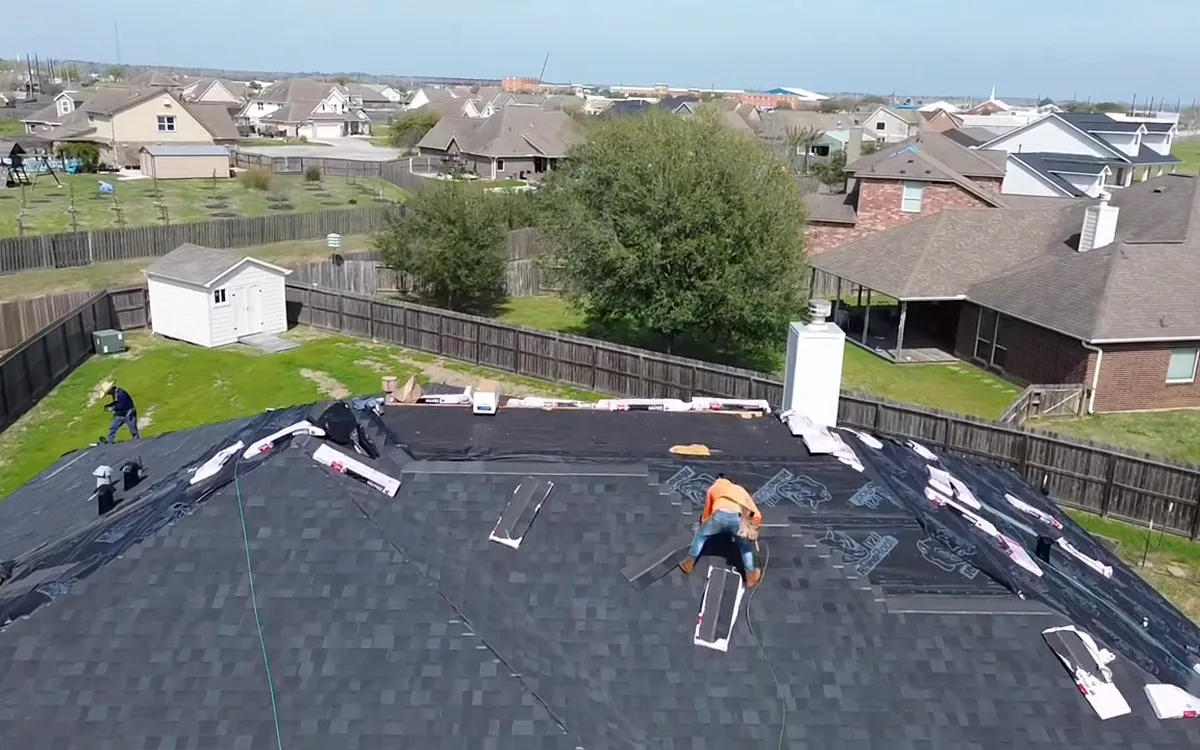 TAC crew installing new shingles on a residential roof